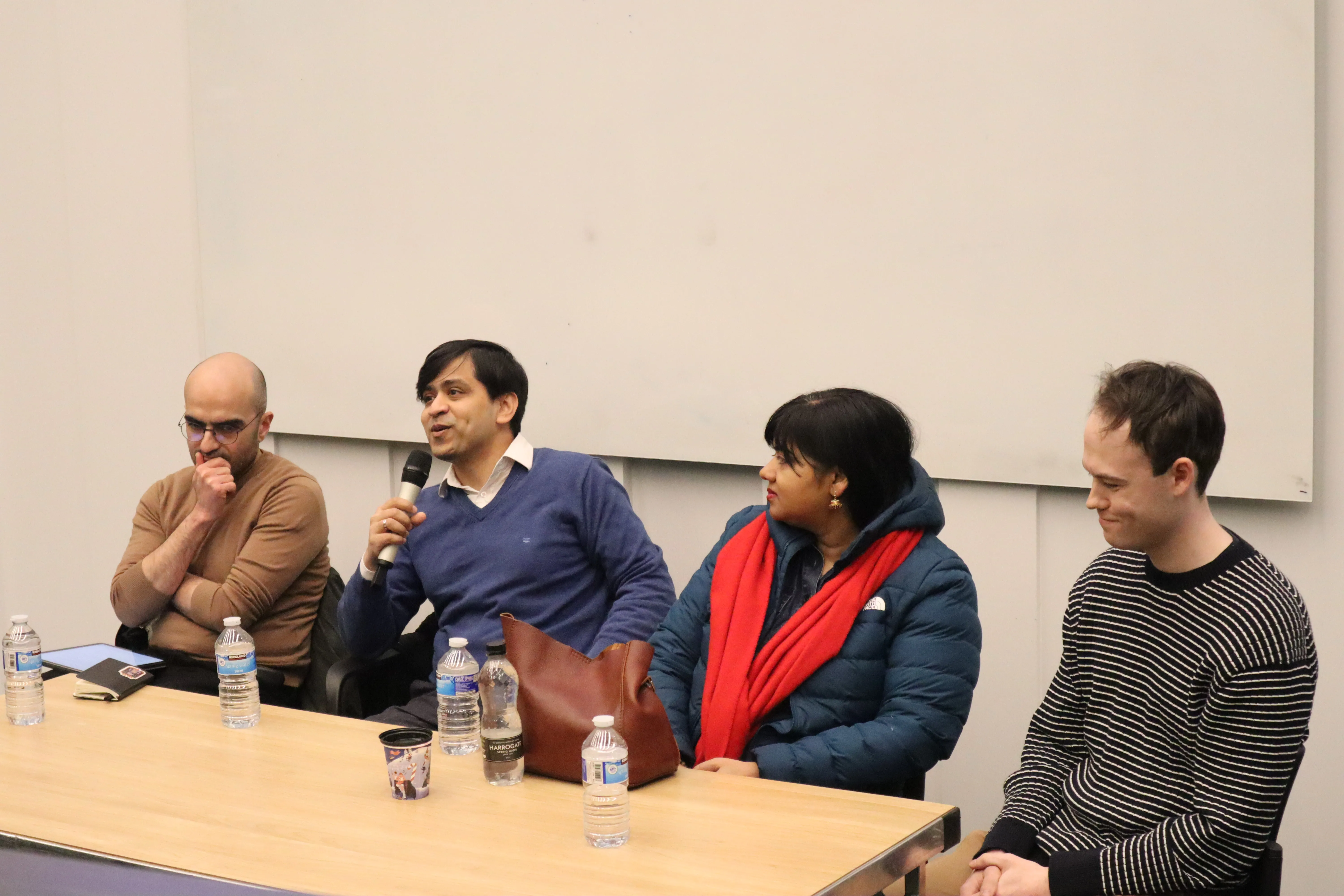 An AI safety panel discussing at the 2025 summit