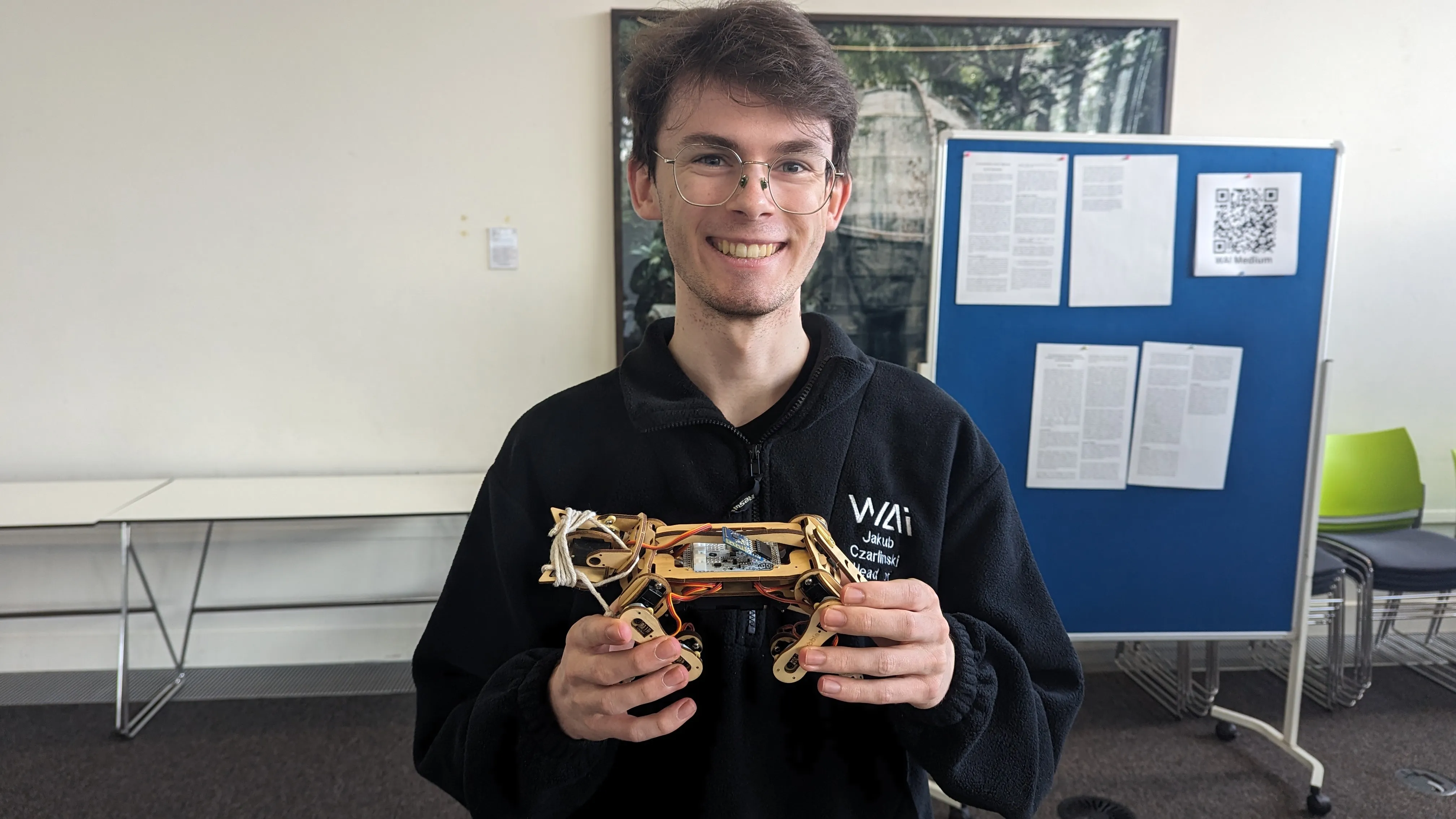 A WAI member shows a robot cat